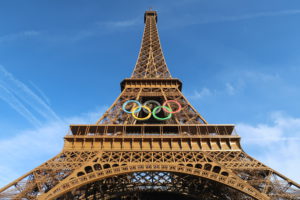 The Eiffel Tower embellished with the Olympic rings, showcasing a festive tribute to the upcoming Olympic Games in Paris.