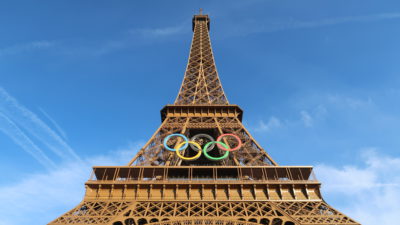 The Eiffel Tower embellished with the Olympic rings, showcasing a festive tribute to the upcoming Olympic Games in Paris.